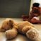 Abused child sitting on the floor in her home hold her teddy bear, suffering from a severe depression.